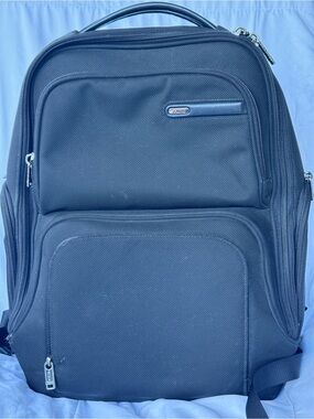 Tumi Black Nylon Travel Backpack with Multiple Compartments